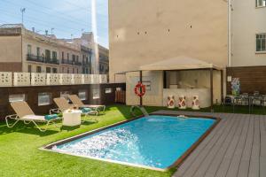 a swimming pool on the roof of a building at Hotel Concordia Barcelona in Barcelona