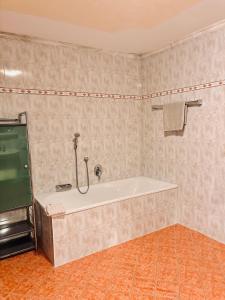 a bathroom with a bath tub in a room at Ferienwohnung Mariengrund in Schönau am Königssee +16 photos