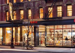 a store front of a building on a city street at Comfortable 2BR & 2 Bath Apt in Downtown NYC in New York