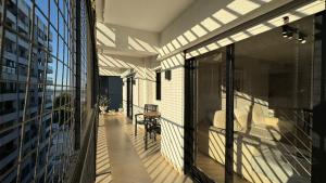a balcony with sliding glass doors on a building at En el Corazón de Rosario in Rosario
