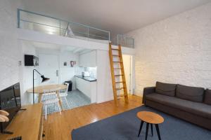 a living room and kitchen with a loft bed at Oporto City View - Trindade in Porto +11 photos