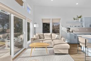 a living room with a couch and a table at Bay View Loft in Lincoln City