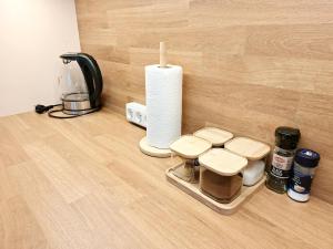 a kitchen counter with a tray with a coffee maker and a candle at Dunes Trail 3 in Melnragė