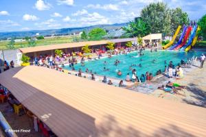 a crowd of people in a pool at a water park at Himaya Garden in Lanet