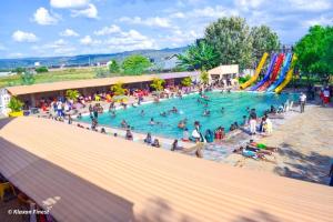 a group of people in a pool at a water park at Himaya Garden in Lanet