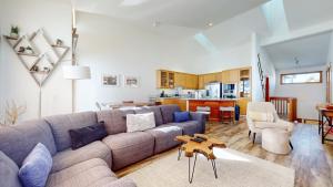 a living room with a couch and a kitchen at Snowcreek V #777 in Mammoth Lakes +27 photos