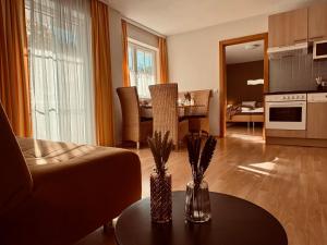 a living room with a couch and a table at Villa Florl in Schladming