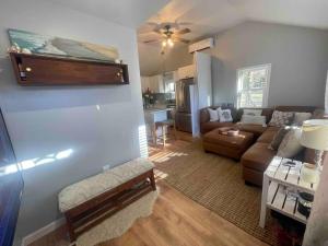a living room with a couch and a table at The Beach Gallery in Narragansett