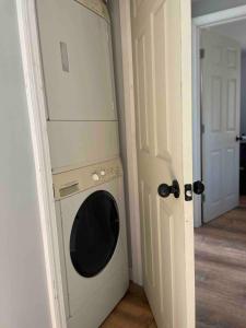 a washing machine in the corner of a room at The Beach Gallery in Narragansett