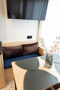 a living room with a table and a couch at Echoes of Thrace in Xanthi