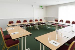 a row of tables and chairs in a room at The Galleon Hotel, Hull City, Part of the AG Collection in Hull