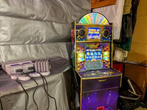 a video game machine next to a phone next to a table at The Shepherd’s Nook in Livingston