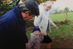 a man and a woman looking at a small child at Lorcival in Savennières +3 photos