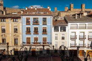 a group of buildings in a city at Piso en Antigua Casa de Correos in Molina de Aragón