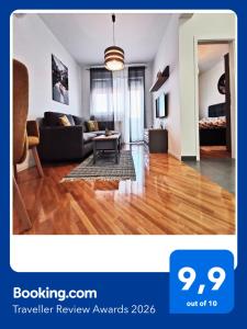 a living room with a couch and a table at Apartman Angel in Osijek