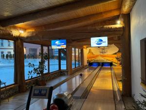 a bowling alley with a ball in the middle at Rezidence u Jezera in Jeseník