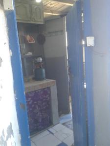 a kitchen being remodeled with a counter in a room at Grotte Panoramique Atlantique d'Aglou in Zaouia Sidi Ouaggag +29 photos