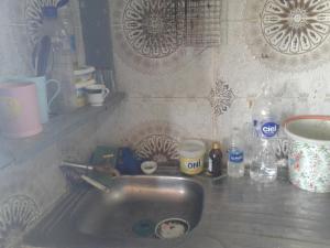 a kitchen counter with a sink in a kitchen at Grotte Panoramique Atlantique d'Aglou in Zaouia Sidi Ouaggag