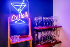 a bunch of wine glasses on shelves in a bar at West Pier Beach - by Brighton Holiday Lets in Brighton & Hove