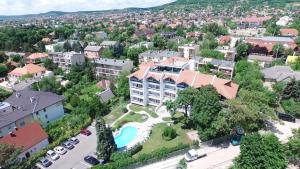 an aerial view of a city with a large building at Holiday Art Garden&Spa in Balatonfüred