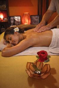 a woman getting a massage on a bed at La Lucques Masabelle in Mirepeisset