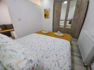 a bedroom with a bed with two towels on it at Konak Jerma-Kanjon Jerme Pirot in Pirot