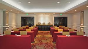 a conference room with red and yellow tables and chairs at Crowne Plaza Panama by IHG in Panama City +81 photos