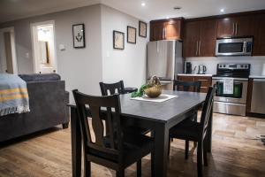 a kitchen and dining room with a table and chairs at 92179 Newfoundland & Labrador Limited in St. John's