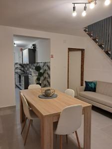 a dining room table and chairs in a living room at Holiday Home Manuela in Fažana +14 photos