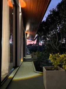 a hallway of a building at night with lights on at Sol & Luna in Katunayaka