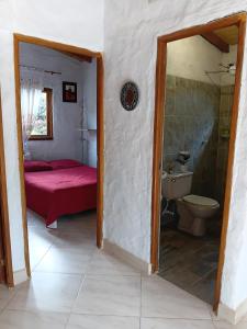 a bathroom with a bed and a toilet in a room at Cabaña campestre in Medellín +45 photos