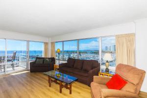a living room with a couch and a table at Ilikai Tower 943 in Honolulu