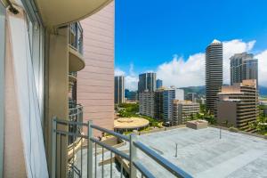 a balcony with a view of a city skyline at Ilikai Marina 1383 in Honolulu +12 photos