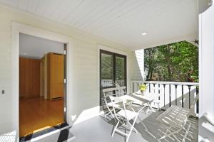 a dining room with a table and chairs on a balcony at Perfect Friends Getaway in Sonoma in Sonoma