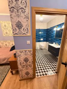 a bathroom with a toilet and a sink and a shower at Noclegi u Ewy in Witów +53 photos