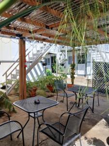 a group of tables and chairs in a patio at La 10a de Las Charcas in Guatemala