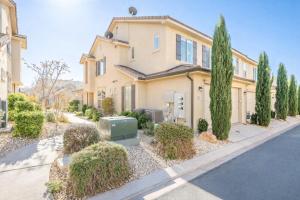 a house with trees in front of a street at Adventures Base! Family Friendly w heated community pool in Washington