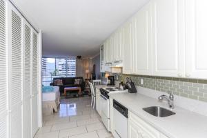 a kitchen with a sink and a counter top at Ilikai Marina 987 in Honolulu