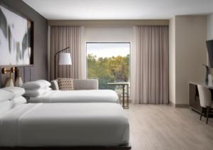 a hotel room with two beds and a window at Indianapolis Marriott East in Indianapolis