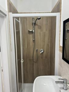 a bathroom with a shower with a toilet and a sink at Valdambra B&B in Ambra +41 photos