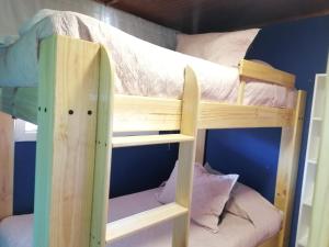 a couple of bunk beds in a room at Apartamento Cuadruple in Isla de Maipo