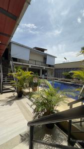 a resort with a swimming pool and a building at Casa Hotel Estelar in Villavieja