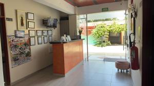 a restaurant with a bar and a television in a room at Casa Hotel Estelar in Villavieja +51 photos
