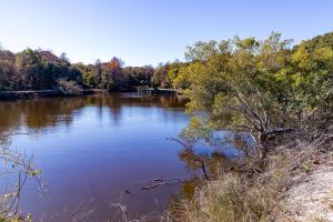 a view of a lake with trees in the background at Casa La Playa - Duck, Sanderling, Lakefront, 160 Yards to the Beach, Community Pool, Pets OK in Duck