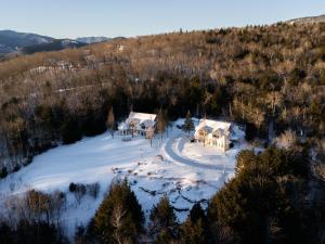 an aerial view of a house in the snow at Nordic Village Condominium Resort in Jackson