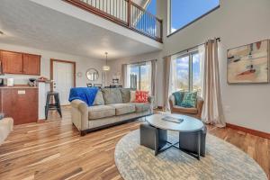 a living room with a couch and a table at Bridges Bay Vacation Cabin 33 in Arnolds Park