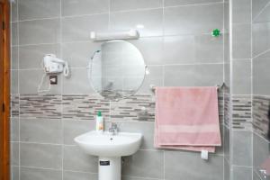 a bathroom with a sink and a mirror at Appartement Laaz in Midelt +88 photos