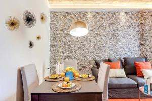 a living room with a table and a couch at Vaticano luxury sleep in Rome