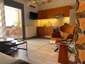 a living room with a couch and a table at Sandy's apartment in Ancient Epidauros +36 photos