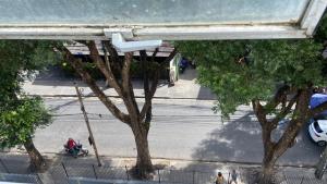 an overhead view of a street with trees and a motorcycle at Izabelly Andrade in Recife